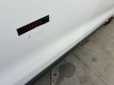 a sticker on the side of a white car
