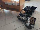 a kitchen with a lot of dishes and utensils on the floor