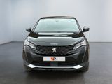 the front view of a black car in a white room