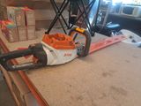 a chainsaw sitting on a counter next to a box of boxes