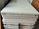 a stack of mattresses stacked on top of each other in a room