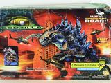 a box of godzilla action figures on a white surface