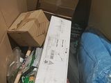 a cardboard box full of items in the middle of a room
