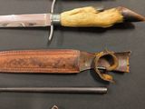 several different types of knives are displayed on a black surface