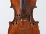an old violin with a wooden back and bow on a white background