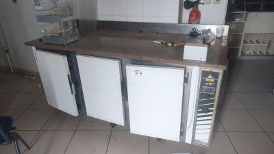 a kitchen with a stove, oven, and cabinets in it