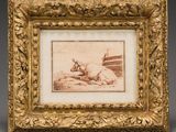 une vieille photo représentant un taureau couché par terre, dans un cadre doré
