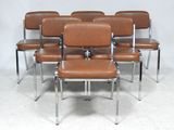 six brown leather chairs sitting in a row on a white floor