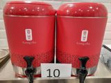 two red containers that are sitting on a counter