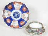 a blue and orange plate and a cup and saucer