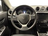 the interior of a car with a steering wheel and dashboard controls