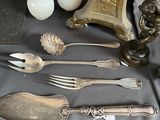 a table with a lot of silverware on it