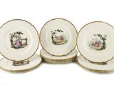 quatre assiettes avec l'image d'un homme et d'une femme