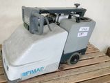 a machine that is sitting on a pallet in a room