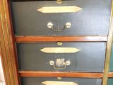 four suitcases stacked on top of each other in a room