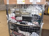 a metal cart with many items in it in a warehouse