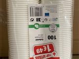 two packs of white disposable cups in plastic bags