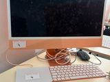 a computer on a desk with a keyboard and mouse