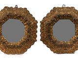 pair of antique carved wood mirrors with a gold frame
