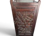 a wooden cabinet with a glass top on a white background