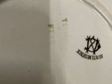 a white plate with a black and white design on it