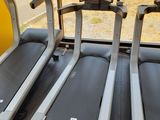 two treads on the tread machines in the gym