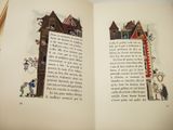 a book open with a picture of a house on it