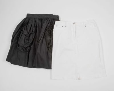 a pair of white and black skirts on a white background