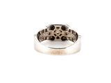 a close up of a ring on a white surface with a white background
