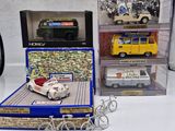 a box with a toy car and a toy van in it
