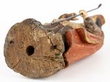 a small wooden object with a piece of wood sticking out of it