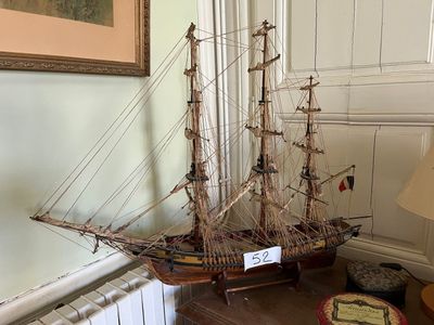 a model of a ship on a table in a room