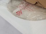 a box of pizza sitting on top of a white table