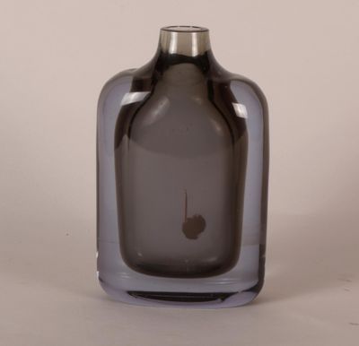 a gray glass vase with a silver top