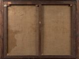 an old wooden frame with a picture hanging on the wall