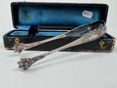 two spoons sitting in a box on a table