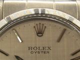 a rolex oyster watch with a crown on the dial
