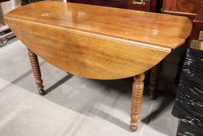 Table à volets XIXème en bois naturel.