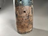 a bottle of wine that is sitting on a table