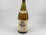 a bottle of wine that is sitting on a table
