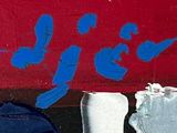 a red wall with blue writing on it and a blue umbrella