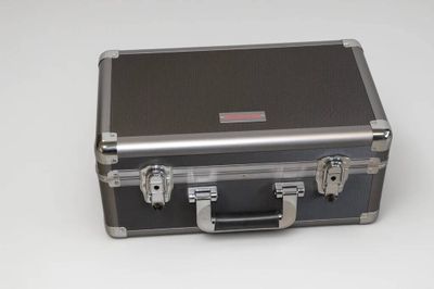 a metal case with two handles on a white surface