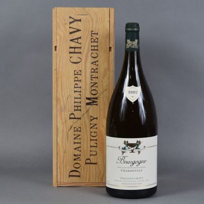 the bottle of wine is next to a wooden box