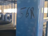 a blue sign that says 5r on the side of a building