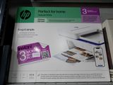 a box with a printer on it sitting on a shelf