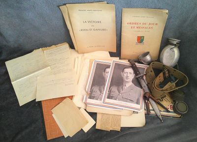 a pile of old books and papers sitting on a couch
