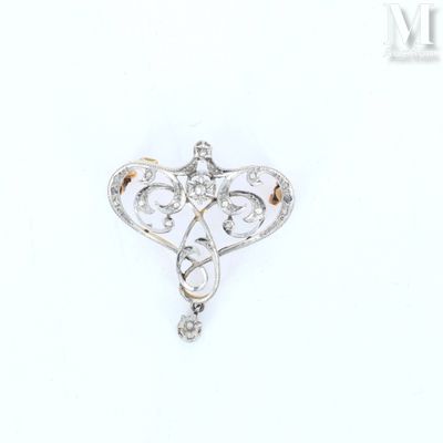 an image of a diamond heart broochle on a white background