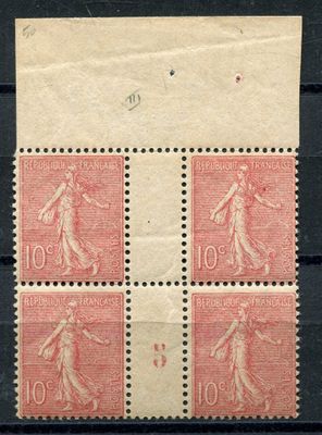 a stamp with four different images of a woman on it