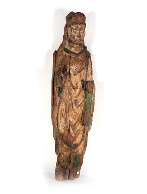 une vieille statue en bois représentant un homme barbu coiffé d'un chapeau