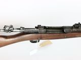 an old rifle with a wooden barrel and a metal muzzle